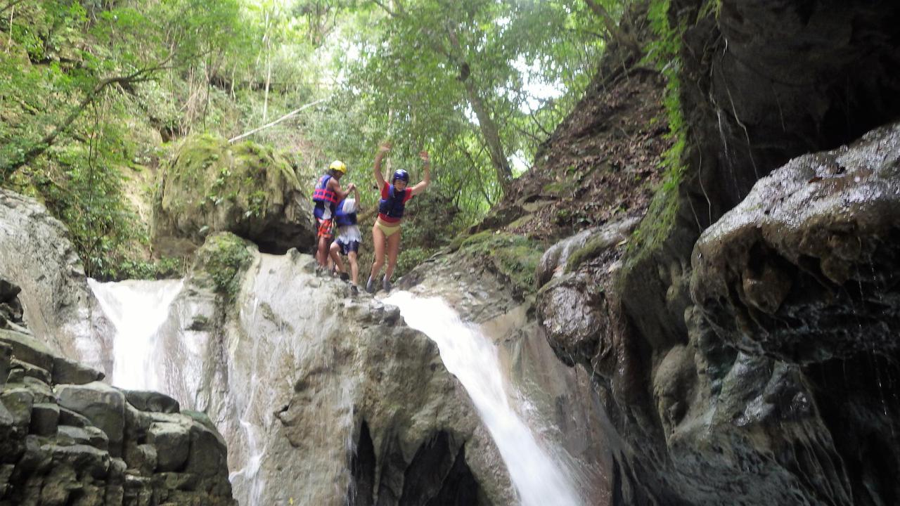 Jumping down alongside one of the 27 waterfalls at Damajagua